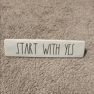 White Ceramic Sign with Black Text